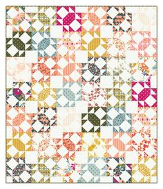 a colorful quilt with many different designs on the front and back, all in various colors