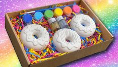 a box filled with donuts covered in sprinkles