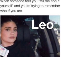 a woman sitting in a car with the caption leo