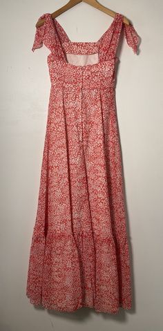 This floral maxi dress is the stuff of dreams! It is Union Made and from the 1970's, made predominantly of cotton and polyester. It's a gorgeous dress and perfect for spring and summer! It is a coral pink color with a white floral pattern on it. It is closest to a modern day size 2/4, but here are the exact measurements taken lying flat and doubled: Shoulders: 15 inches Chest: 28 inches Waist: 24 inches Hips: 30 inches Shoulders to Hem: 50 inches This dress has an inner lining too, so it keeps i Ditsy Floral Print Maxi Sundress, Ditsy Floral Print Maxi Sundress For Day Out, Maxi Length Ditsy Floral Sundress For Day Out, Sundress With Ditsy Floral Print Maxi Length, Maxi Sundress With Ditsy Floral Print For Vacation, Maxi Dress With Ditsy Floral Print For Day Out, Ditsy Floral Print Maxi Dress For Day Out, Flowy Ditsy Floral Print Maxi Sundress, Maxi Sundress With Ditsy Floral Print