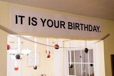 it is your birthday sign hanging from the ceiling