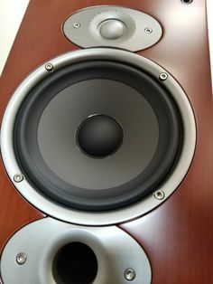 two speakers are sitting side by side on a table