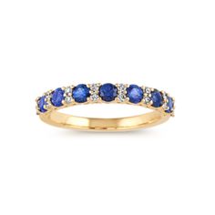 This dazzling ring features traditional blue natural sapphires alternating with stacked natural diamond accents. Crafted in warm 14-karat yellow gold  it makes a gorgeous daily accessory or addition to any ring stack. Classic Sapphire Stackable Diamond Ring, Yellow Gold Stackable Sapphire Ring, Classic Stackable Sapphire Rings In Yellow Gold, 14k Gold Sapphire Half Eternity Ring, Classic Stackable Sapphire Ring With Diamonds, Classic Stackable Sapphire Diamond Ring, Yellow Gold Sapphire Stackable Eternity Band, Yellow Gold Sapphire Eternity Band Fine Jewelry, Yellow Gold Sapphire Eternity Band