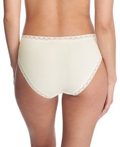 A true everyday pant. Super soft and comfortable. The stretch lace trim at your waist and legs offers an easy custom fit for all day comfort that won't shift when wearing or show through clothes. Flattering French cut shape with high cut front leg Natori pima cotton is soft and comfortable with lace at edges for no dig in Side seams sit towards the front to provide maximum back coverage Sits above the hips Cotton gusset Body: 94% Pima Cotton 6% LYCRA® Lace: 84% Nylon 16% Elastane Gusset: 100% Co High-cut Leg Cotton Bottoms With Elastic Waistband, Cotton Bottoms With Elastic Waistband And High-cut Leg, Cream Stretch Bottoms With Elastic Waistband, Elegant Brief Bottoms For Loungewear, Cream Bottoms With Elastic Stretch Waistband, Cream Lace Trim Bottoms For Loungewear, Beige Cotton Bottoms With Lace Trim, Cotton High-cut Leg Bottoms For Daywear, Elegant High-cut Leg Bottoms For Daywear