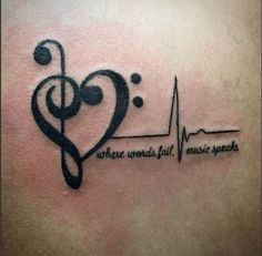 a tattoo with music notes and a heart