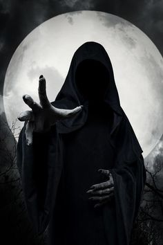 a person dressed as a nun in front of a full moon with their hands out