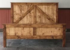 a bed frame made out of wood with two doors on the top and bottom side