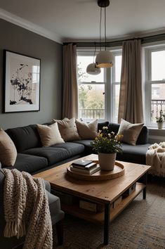 a living room filled with furniture and a large window next to a wooden coffee table