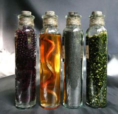 three bottles filled with different types of liquid