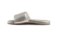 The BAZA leather slide sandal features a leather wrapped memory foam sole with molded arch. We added EXTRA padding to the platform and wrapped it in buttery-soft leather. For the upper we took the softest leather we could find and wrapped it around a cushy memory foam strap. Our commitment to sustainability is evident in our use of vegetable-tanned leathers, recycled and recyclable products, packaging, and leather sourced from tanneries certified by the Leather Working Group. Read more in the Our Footprint section of our site. So you'll be making a stylish statement while treading lightly on the planet. Shop BAZA leather slide sandals in our black, honey, silver colors and more. Materials + Construction * Soft leather-wrapped molded memory foam insole - because your feet deserve the best.* Adjustable Leather Slip-on Slides, Adjustable Comfortable Leather Slides, Comfortable Adjustable Leather Slides, Adjustable Leather Slides With Rubber Sole, Leather Slides With Removable Insole, Leather Slides With Rubber Sole, Modern Adjustable Leather Slides, Comfortable Summer Slides With Leather Lining, Products Packaging