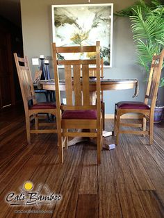 a wooden table and chairs in a room