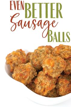 a white bowl filled with fried sausage balls on top of a wooden table next to a red and green sign that says, even better sausage balls