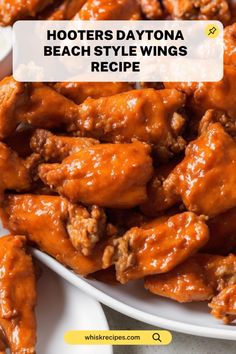 a plate full of chicken wings with the words, hooters daytona beach style wings recipe