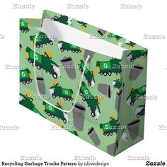 a green shopping bag with trucks and garbage cans printed on the front, side view