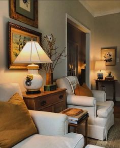 a living room filled with furniture and a lamp