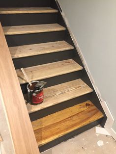 some wooden steps with paint on them in a room that is being remodeled and painted