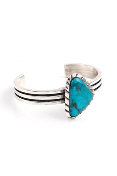 This contemporary sterling silver cuff was created by noted Zuni silversmith, Ric Laselute. He is known for his attention to detail selecting only the finest stones for his jewelry. This bracelet features an exquisite triangle of genuine brilliant blue Turquoise set in a raised hand cut sterling silver bezel. The oxidized and hand cut silver cuff finishes this unique piece. Hallmarked "Ric Laselute" and stamped "Sterling". Fits 6.5" wrist, adjustable Native Jewelry, Turquoise Cuff, Sterling Silver Cuff, Cuff Bangles, Multi Stone, Silver Cuff, Blue Turquoise, Copper Jewelry, Turquoise Bracelet