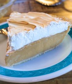 a piece of pie on a blue and white plate