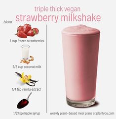 a pink smoothie in a tall glass with ingredients to make it look like strawberry milkshake