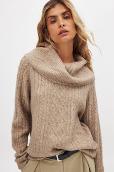 This cable knit sweater features an oversized fit and a stretchy, soft knit material. It has a large, ribbed, loose turtleneck. Knitted Turtle, Loose Turtleneck, Beige Pullover, Sweaters Women, Turtle Neck Sweater, Business Outfit, Beige Sweater, Cable Knit Sweater, Knitting Materials