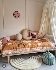 a child's bedroom with a bed, rugs and other items on the floor