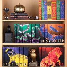 the books are lined up on the shelves with harry potter's bookends