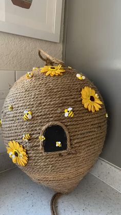 a bird house with sunflowers on it