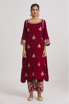 Red velvet kurta with floral hand, machine embroidery. Paired with pyjama.
Components: 2
Pattern: Embroidered
Type Of Work: Floral
Neckline: Round
Sleeve Type: Three quarter
Fabric: Velvet
Color: Red
Other Details: 
Cutwork border sleeve detailing
Model height: 5ft 11inches, wearing size M
Occasion: Wedding - Aza Fashions Velvet Kurta, Red Kurta, Straight Kurta, Velvet Color, Pajama Set Women, Pyjama Set, Cut Work, Sleeve Detail, Set For Women