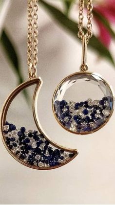 two necklaces with blue and white stones in them on a gold plated chain