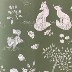 an image of foxes in the forest with apples and leaves on it's back