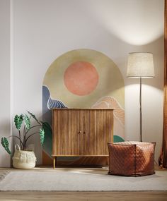 a living room with a wooden cabinet and potted plants on the floor next to it