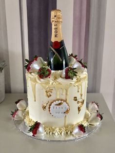 a cake with a bottle of champagne on top