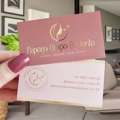 a person holding up a business card in their hand with the word spago cero & mente on it