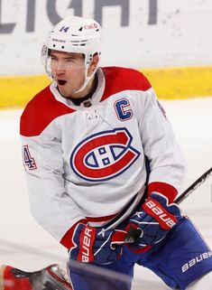 a hockey player is looking at the camera