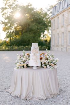 a wedding cake sitting on top of a table