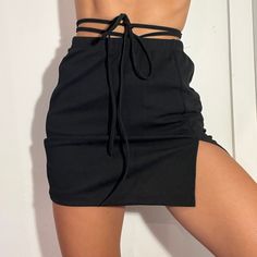 Size Small Black Tie Mini Skirt Never Worn Casual Split Bottoms For Party, Split Bottoms For Club And Summer, Trendy Black Split Bottoms, Casual Black Split Skirt, Black Skort For Club In Spring, Spring Club Black Skort, Black Skort For Club, Spring Season, Black Skort For Club And Spring Season, Casual Black Bottoms With Split