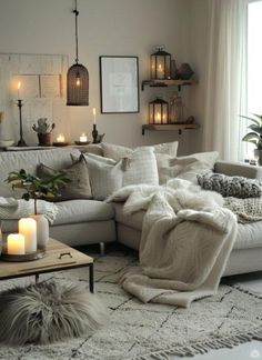 a living room filled with furniture and candles