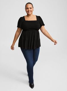 FIT Model is 5'10” wearing size 1. Measures 30” from shoulder (size 2). MATERIALS + CARE Washable Gauze woven fabric: The lightweight, breathably soft fabric you love is, at last, wash, wear and go! . Stretch level: None. 74% rayon, 26% polyester. Machine wash cold. Tumble dry low. Imported. DETAILS Square neckline. . Short sleeves. Smocked bust. . Tiered detail. . . The best plus size women's babydoll washable gauze smocked tiered top & empire waist tops in deep black made of washgauze. Torrid is your destination for cozy fall and winter clothes to keep you warm and comfortable. These babydoll & empire waist tops can be great for pregnant women looking for plus size maternity clothes that will fit with your baby bump and your belly throughout your pregnancy. Black Smocked Back Stretch Top, Stretch Cotton Smocked Top For Fall, Cotton Stretch Smocked Top For Fall, Fall Smocked Back Short Sleeve Top, Fall Short Sleeve Smocked Top With Smocked Back, Fitted Smocked Top For Daywear In Fall, Fitted Smocked Top For Fall Daywear, Stretch Smocked Bodice Short Sleeve Top, Black Stretch Smocked Top