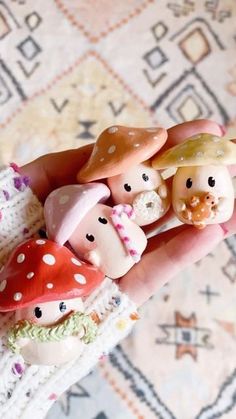 a person is holding some small figurines in their hand