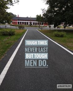 an empty road with the words tough times never last but tough men do