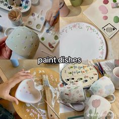 the table is covered with plates and dishes that have been painted on them, while someone holds a paintbrush in their left hand