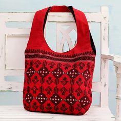 Delightful kite motifs decorate the chili-red body of this shoulder bag from India. Crafted of cotton, the handbag is designed by Manjuri Hazarika. A magnetic snap opens to a black cotton lining, featuring a single inner zipper pocket and a single open pocket. Red Rectangular Cotton Shoulder Bag, Red Cotton Rectangular Shoulder Bag, Red Bohemian Cotton Bags, Bohemian Red Cotton Bags, Traditional Red Shoulder Bag For Everyday Use, Red Bohemian Cotton Shoulder Bag, Square Red Hobo Bag For Daily Use, Red Cotton Shoulder Bag For Daily Use, Red Cotton Shoulder Bag With Adjustable Strap