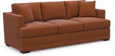 a brown couch sitting on top of a white floor