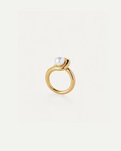 A glass pearl punctuates this modern ring with a raised profile. Finished in high-polish gold. ion-plated gold brass glass pearl finish: high-polish Modern Yellow Gold Pearl Ring For Formal Occasions, Modern Pearl Open Ring With Polished Finish, Classic Gold Pearl Ring With Polished Finish, Modern Pearl Ring For Formal Occasions, Modern Round Pearl Ring In Yellow Gold, Modern Yellow Gold Pearl Ring For Anniversary, Modern Gold Pearl Ring, Modern Gold Pearl Ring For Wedding, Modern Wedding Pearl Ring