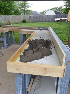 the foundation is being built with wood and cement