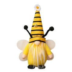 a yellow and black stuffed bee with a flower on it's head, wearing a hat