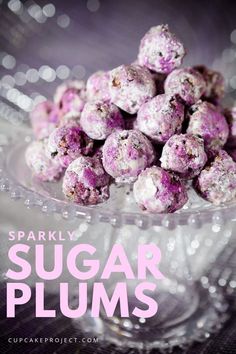 a glass bowl filled with purple candy balls