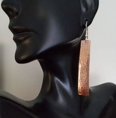 Hammered copper rectangular shape earrings available in 2 sizes. They are slightly narrower at the top. The hammering domes them slightly and hardens the copper just enough so they hold their shape well. They are not heavy. Select size small, 1&1/4 inches long plus the sterling silver ear wire which adds a half inch, or large, 2 inches plus the sterling ear wire. I also offer this style in all sterling silver, Link below. Shipped in a gift box. https://www.etsy.com/listing/240517044/hammered Rectangular Copper Earrings With Ear Wire, Handmade Rectangular Copper Earrings, Hammered Copper Earrings, Hammered Copper, Copper Earrings, Ear Wire, Etsy Earrings, Dangle Drop Earrings, Gift Box