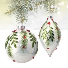 two christmas ornaments hanging from a tree with red berries and green leaves painted on them