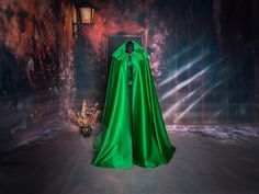 A basic, wide, unlined satin cloak is the perfect complement to any costume because of its magical, shiny, lightweight fabric. The cloak fastens at the front with a small hook in a fantasy style, and at the back the cloak has a very large hood to cover your head comfortably. The outer part of the cloak  is very soft and gentle to the touch. The cloak is easy to wash or clean, and raindrops dry on it quite quickly. The cloak is made of high quality 100% cotton satin (faux silk) and has no lining Fantasy Style, Medieval Fantasy, Soft And Gentle, Rain Drops, Adult Costumes, Cloak, Larp, Cosplay Costume, Lightweight Fabric